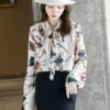 เสื้อเชิ้ตทำงานผู้หญิงสีครีมแต่งลายผูกโบว์แขนยาว
