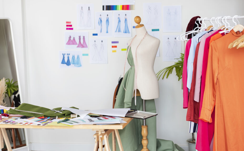 Fashion design studio for sewing and cutting clothes, designer clothes, manufacturing, craft product.